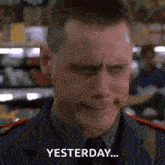a man in a police uniform is crying in a grocery store and saying `` yesterday '' .