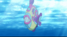 a colorful fish with big teeth is swimming in the water