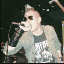 a man singing into a microphone with a shirt that says amfdi