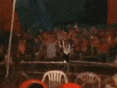 a man and a woman are dancing in front of a sign that says blink-182 on it