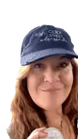 a woman is wearing a hat that says holiness color street blessed
