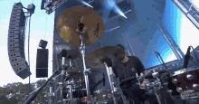 a drummer is playing a zildjian cymbal on a stage
