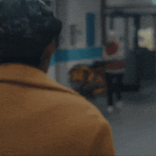 a woman in a hospital hallway says hi belinda in yellow letters