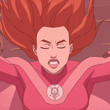 a woman with red hair is wearing a pink superhero outfit with a female symbol on her chest