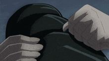 a close up of a person 's fist with a black background