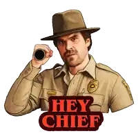 a man in a sheriff 's uniform is holding a binoculars and says hey chief in red letters