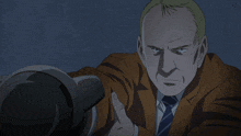 a man in a suit and tie holds a camera in his hand