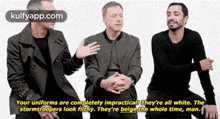 three men are sitting next to each other and one of them is talking about stormtroopers