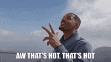 a man says aw that 's hot that 's hot with his fingers in the air