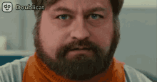 a man with a beard is looking at the camera with doublecat written on the bottom