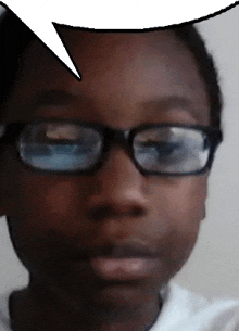 a close up of a person wearing glasses with a speech bubble above his head