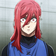 a girl with red hair is wearing a blue shirt that says team
