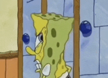 a cartoon of spongebob squarepants standing in front of a door with a blue ball on it .