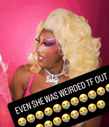 a picture of a drag queen behind a sign that says " even she was weirded tf out "