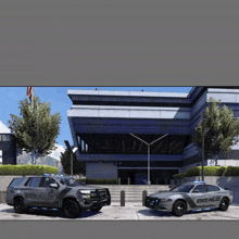 two state police vehicles parked in front of a building