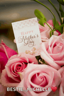 a bouquet of pink roses with a mother 's day card