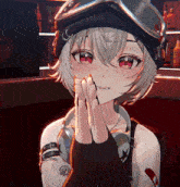 a girl wearing headphones and a goggles with the letter g on her hat