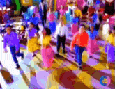 a group of people are dancing in front of a tv that says ' tv time ' on it
