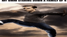a man is kicking a soccer ball in the air with the caption " my 9mm staring down a family of 4 "