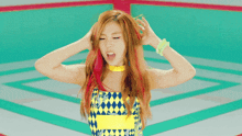 a woman with red hair is wearing a yellow necklace and bracelets