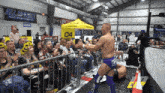 a wrestling ring with a sign that says all sports