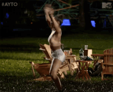 a woman in shorts is dancing in the grass with the hashtag #ayo
