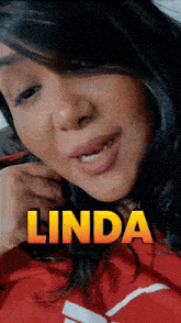 a close up of a woman 's face with the name linda written above her
