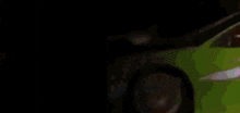 a red car is driving next to a green car in a pixelated image