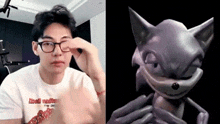 a man wearing glasses next to a picture of a cat .