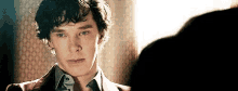 a close up of a man 's face looking at another man 's face .