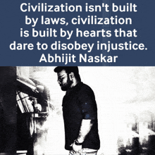a man stands in front of a bookshelf with a quote by abhijit naskar