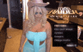 a woman in a cowboy hat is standing in front of a screen that says tomb raider anniversary