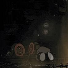 a cartoon character is laying on the ground in a dark room
