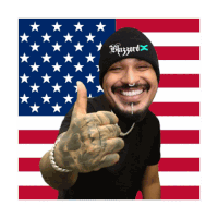 a man wearing a beanie that says blizzard giving a thumbs up in front of an american flag