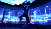 a man is jumping in the air in front of a large screen with a city in the background .