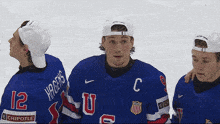 a hockey player with the number 12 on his jersey