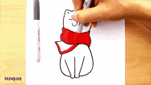 a person is drawing a cat wearing a red scarf with a drawbook marker