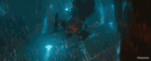 a scene from the movie aquaman is shown in a blurry image