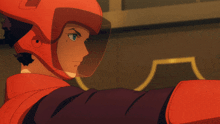 a person wearing a red helmet with a visor on it