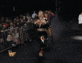 a wrestler named ray del ray walks down a ramp