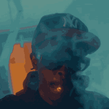 a man wearing sunglasses and a ny hat smoking a cigarette