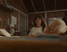 a girl in a white shirt with a whale on it