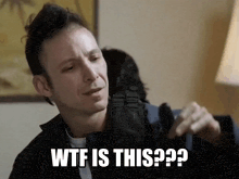 a man is holding a bag and says wtf is this??