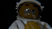 a cartoon character in an astronaut 's helmet with a yellow face