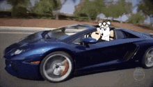 a blue sports car is driving down the road with a cartoon character in the driver 's seat