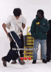 a man dancing in front of a yellow sign that says sturdy