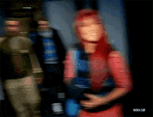 a blurry picture of a woman with red hair holding a microphone