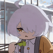 a close up of a cartoon character eating a green leaf with chopsticks .
