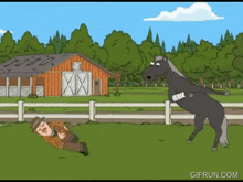 a man is laying on the ground while a horse stands on its hind legs
