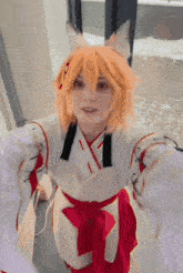 a girl in a fox costume taking a selfie